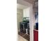 Laundry room with modern washer and dryer units and storage cabinets at 828 Cedar Stream Ct, Loganville, GA 30052