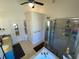 The main bathroom is equipped with double sinks, tile flooring, a separate shower, and a soaking tub at 828 Cedar Stream Ct, Loganville, GA 30052