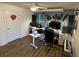 Office with a desk, computer, and musical instruments at 828 Cedar Stream Ct, Loganville, GA 30052