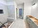 Modern bathroom featuring a tiled shower, sleek vanity, and contemporary fixtures at 1239 Pj East Rd, Covington, GA 30014
