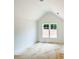 Bright bedroom featuring white walls, large window, and plenty of natural light at 1239 Pj East Rd, Covington, GA 30014