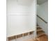 Mudroom with a built-in bench, storage cubbies, and a view of the staircase at 1239 Pj East Rd, Covington, GA 30014