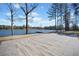 Lakeside patio surrounded by trees with serene water view at 1401 Rainey Rd, Temple, GA 30179