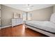 Well-lit bedroom with hardwood floors and neutral walls at 1401 Rainey Rd, Temple, GA 30179