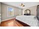 Cozy bedroom with hardwood floors and a dresser with large mirror at 1401 Rainey Rd, Temple, GA 30179