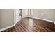 Bedroom showcasing sleek hardwood floors, and a serene space with natural light, and a window AC unit at 1401 Rainey Rd, Temple, GA 30179