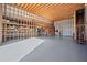 Spacious garage with ample storage, exposed wood beams and high ceilings at 1401 Rainey Rd, Temple, GA 30179