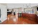 Spacious kitchen features granite countertops, stainless steel appliances, and hardwood floors at 1401 Rainey Rd, Temple, GA 30179