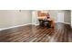 Open-concept kitchenette includes a rustic bar, seating, and modern appliances at 1401 Rainey Rd, Temple, GA 30179