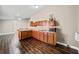 Charming kitchenette with wood cabinets, sink, microwave, and ample counter space at 1401 Rainey Rd, Temple, GA 30179