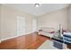 Bright office space with hardwood floors, a sofa, and a modern desk at 1401 Rainey Rd, Temple, GA 30179