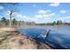 A waterfront view showcasing the lake and private dock, creating a serene and picturesque setting at 1401 Rainey Rd, Temple, GA 30179