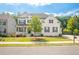 Charming two-story home with white brick, black shutters, green lawn, and a neatly paved driveway at 384 Carmichael Cir, Canton, GA 30115