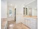 Bright bathroom featuring marble floors, granite countertops, and a glass shower at 1225 W Wesley Nw Rd, Atlanta, GA 30327