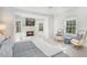 Bright bedroom featuring a cozy fireplace, chair, and plush carpet at 1225 W Wesley Nw Rd, Atlanta, GA 30327