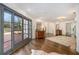 Bright foyer featuring hardwood floors, large windows, and a stylish rug at 1225 W Wesley Nw Rd, Atlanta, GA 30327