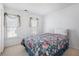 Cozy bedroom with patterned bedding and bright natural light at 1370 Wheatfield Dr, Lawrenceville, GA 30043