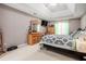 Comfortable bedroom featuring tray ceilings, soft carpet and light-colored walls at 1370 Wheatfield Dr, Lawrenceville, GA 30043