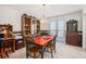 Formal dining room with a wooden table, decorative chandelier, and built-in hutch at 1370 Wheatfield Dr, Lawrenceville, GA 30043