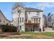 View of the rear of the home including the upper and lower decks at 1370 Wheatfield Dr, Lawrenceville, GA 30043