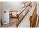 Entryway featuring a staircase and a view into the living room, with hardwood flooring and neutral paint at 1370 Wheatfield Dr, Lawrenceville, GA 30043