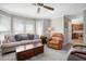 Bright living room with neutral colors, large windows and comfortable seating at 1370 Wheatfield Dr, Lawrenceville, GA 30043