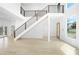 Bright foyer with hardwood floors, a staircase, and natural light from a large window at 1650 Eastport Se Ter, Atlanta, GA 30317