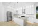 Kitchen with white cabinetry, stainless steel appliances, and granite island at 1650 Eastport Se Ter, Atlanta, GA 30317