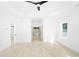 Large main bedroom featuring light wood floors, a ceiling fan, and an ensuite bathroom at 1650 Eastport Se Ter, Atlanta, GA 30317