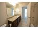 Bathroom featuring a large vanity with granite counters and a bath/shower combo at 2453 Osceola Rd, Lithonia, GA 30058