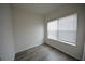 Bedroom with hardwood floors and white walls with natural light coming through window at 2453 Osceola Rd, Lithonia, GA 30058