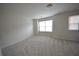 Bedroom featuring natural light, plush carpeting, and neutral wall paint at 2453 Osceola Rd, Lithonia, GA 30058