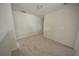 Hallway featuring neutral carpeting and paint, offering a versatile space at 2453 Osceola Rd, Lithonia, GA 30058