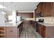 Beautiful kitchen featuring dark wood cabinets, granite countertops, and stainless steel appliances at 2453 Osceola Rd, Lithonia, GA 30058