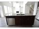 Kitchen island with granite countertop and stainless steel dishwasher at 2453 Osceola Rd, Lithonia, GA 30058