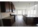 Spacious kitchen with stainless steel appliances, granite countertops, and modern cabinetry at 2453 Osceola Rd, Lithonia, GA 30058