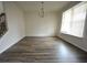 Spacious living room with hardwood floors, chandelier, and natural light at 2453 Osceola Rd, Lithonia, GA 30058