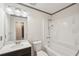 This is a clean bathroom featuring a vanity with sink, toilet, and tub with shower at 489 Natasha Dr, Auburn, GA 30011