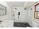 Modern bathroom with glass shower, black fixtures and neutral-toned vanity at 489 Natasha Dr, Auburn, GA 30011