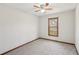 Bedroom with neutral paint, carpeted flooring, and a ceiling fan with light at 489 Natasha Dr, Auburn, GA 30011