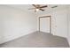 Neutral bedroom featuring a ceiling fan, closet and carpeted flooring at 489 Natasha Dr, Auburn, GA 30011