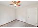 This bedroom features carpet flooring and a ceiling fan for added comfort at 489 Natasha Dr, Auburn, GA 30011