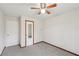 This is a cozy bedroom with a ceiling fan and neutral carpeting at 489 Natasha Dr, Auburn, GA 30011