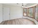 Dining room with a bay window, wood-look flooring, and a door to the backyard at 489 Natasha Dr, Auburn, GA 30011