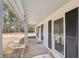 Covered front porch featuring white siding, black shutters, and a welcoming front door at 489 Natasha Dr, Auburn, GA 30011