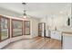 Modern eat-in kitchen featuring stainless steel appliances, a bay window, and white cabinets at 489 Natasha Dr, Auburn, GA 30011