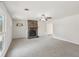 Spacious living room featuring a stone fireplace, ceiling fan, and natural light at 489 Natasha Dr, Auburn, GA 30011