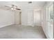 Spacious living room with fresh paint, neutral carpet, and natural light at 489 Natasha Dr, Auburn, GA 30011