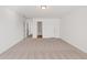 Spacious bedroom with neutral carpeting, connecting doors to bathroom and closet at 1269 Pj East Rd, Covington, GA 30014