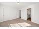 Bright bedroom with ensuite bathroom featuring a modern vanity and neutral carpeting at 1269 Pj East Rd, Covington, GA 30014